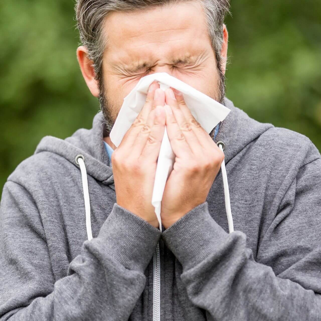 man sneezing
